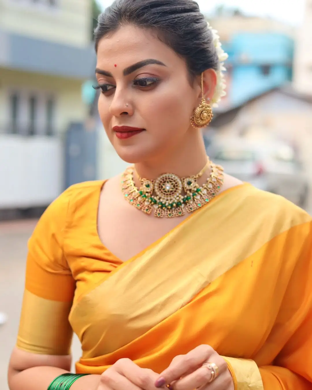 Anusree Nair Wearing Beautiful Earrings Jewellery Orange Saree Blouse